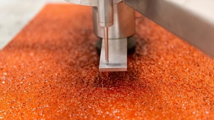 Test device positioned on the rubber granule surface of a synthetic athletics track