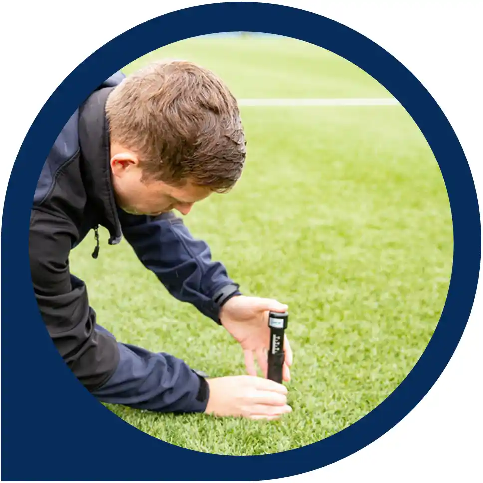 A Sports Labs specialist does an infill depth measurement.