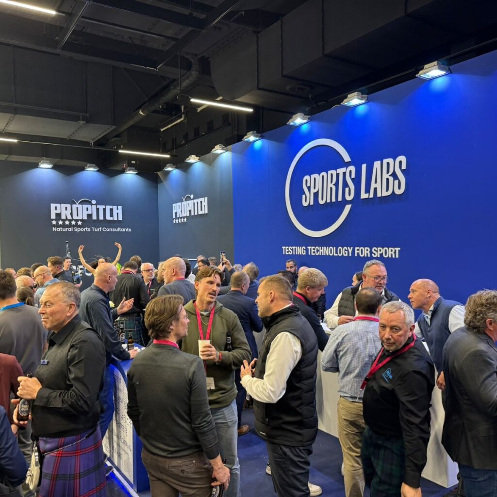 Visitors gathered at the Sports Labs exhibition stand at a trade event