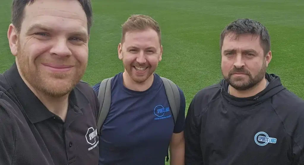 Three Sports Labs field technicians on a grass pitch