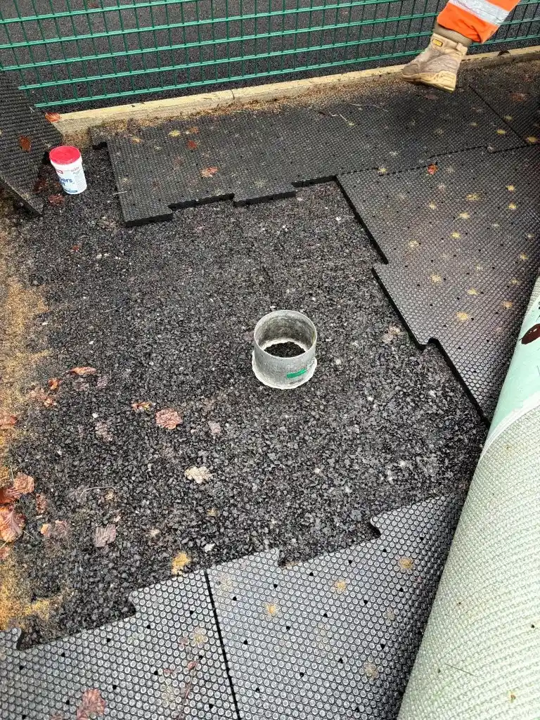 Infiltration test ring placed on an exposed shockpad and dynamic layer at the edge of a 3G pitch