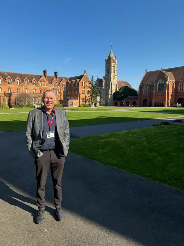 Sports Labs consultant walking past historic university buildings