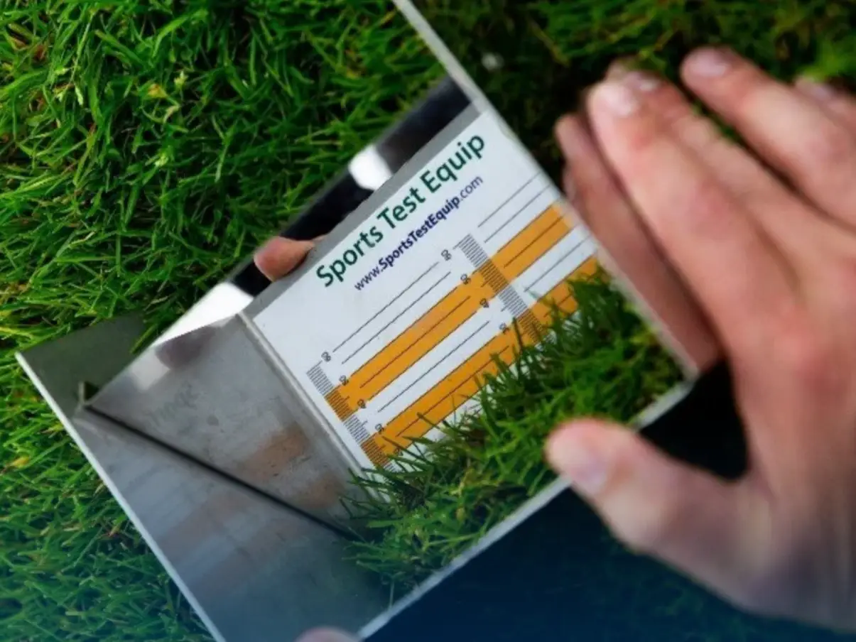 Close up of the Prism Gauge angled mirror and millimetre scale being read by hand