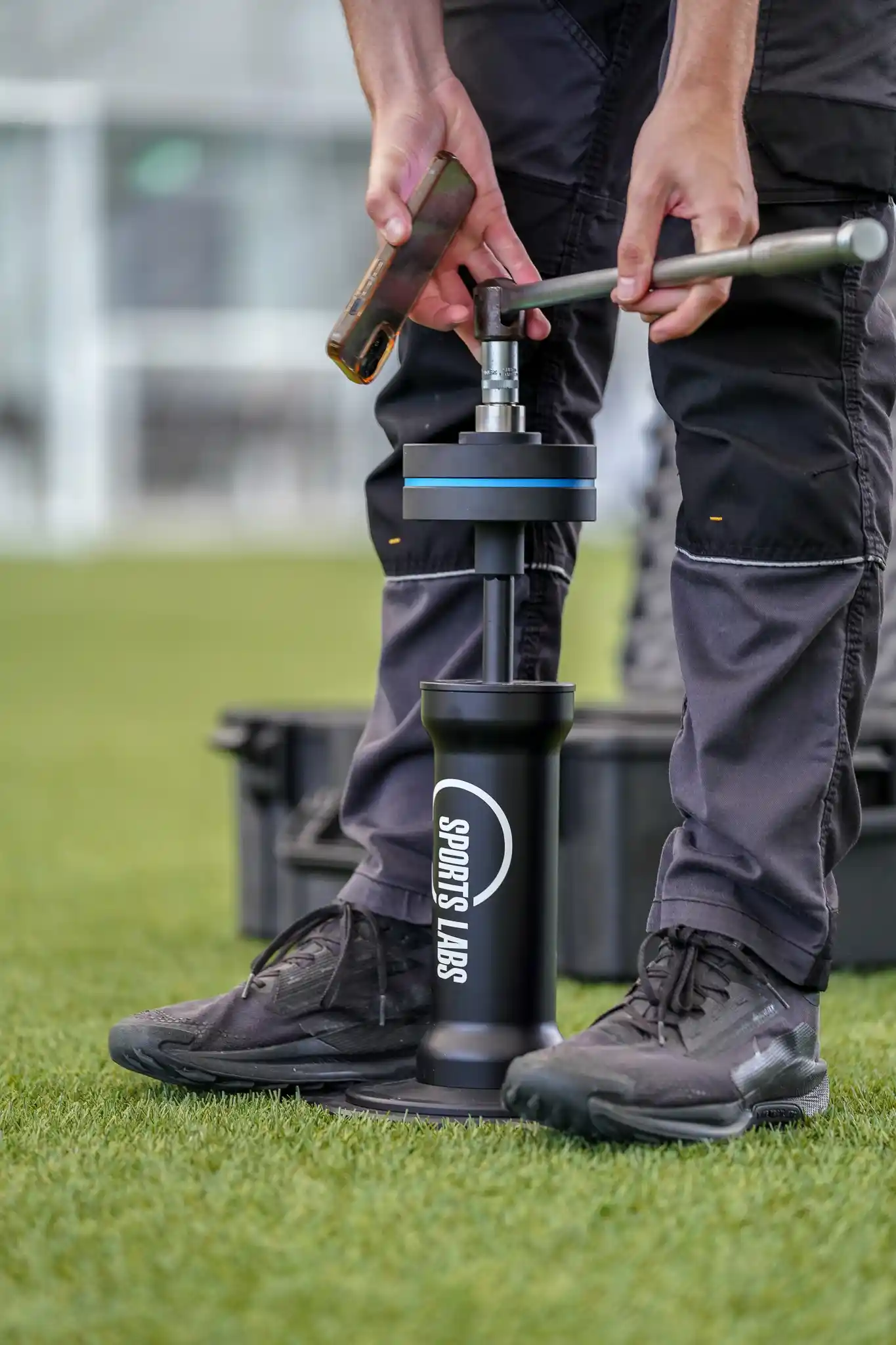 Drop hammer test device being used to measure surface hardness on a natural turf pitch